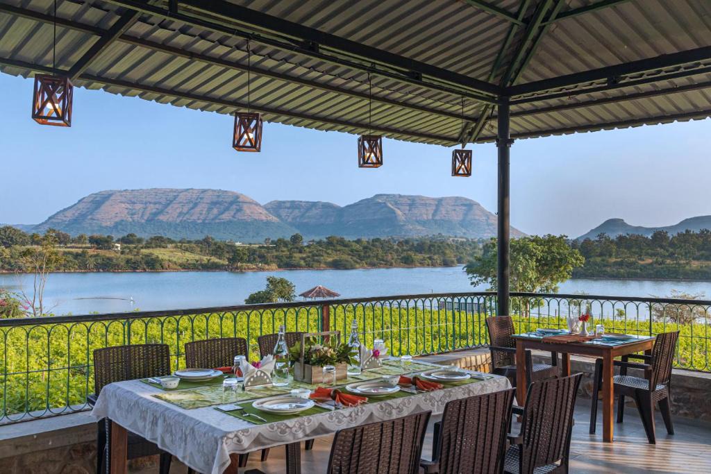 Mahiravani Villa | SaffronStays Lake House Bouganvillea, Nashik -villa with great lake views and patio dining