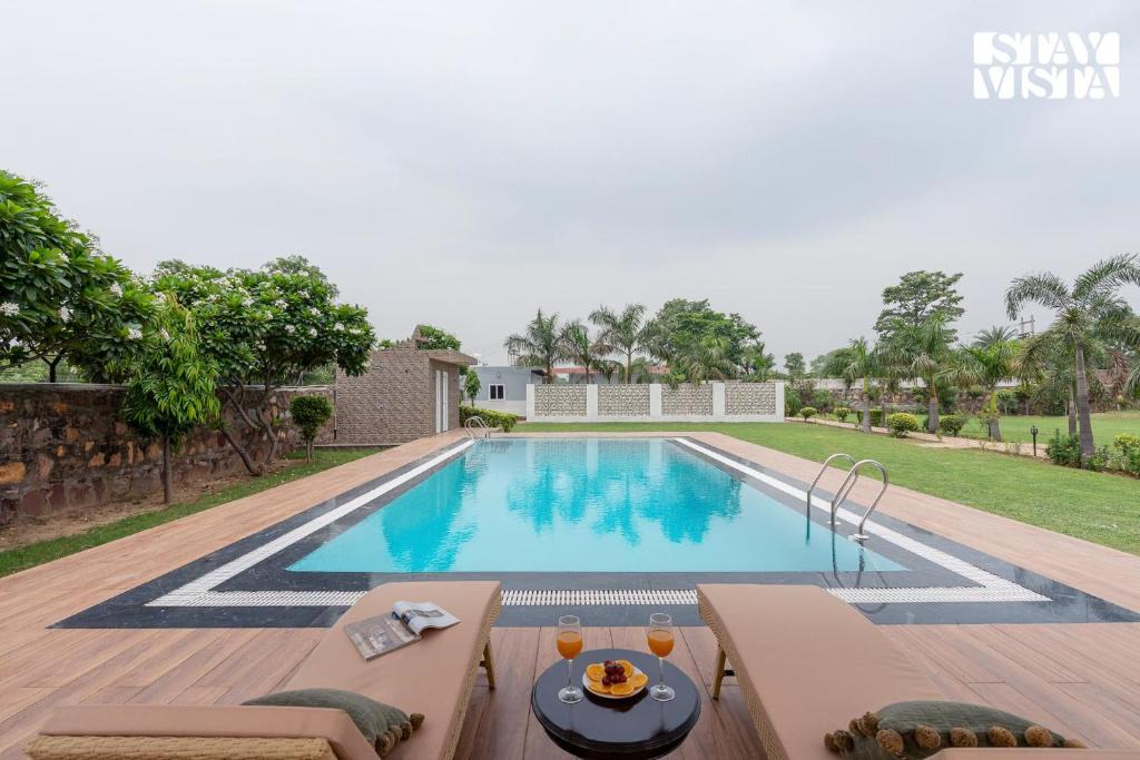Gurugram Villa | StayVista at Sunrise Manor with Pool and Lawn