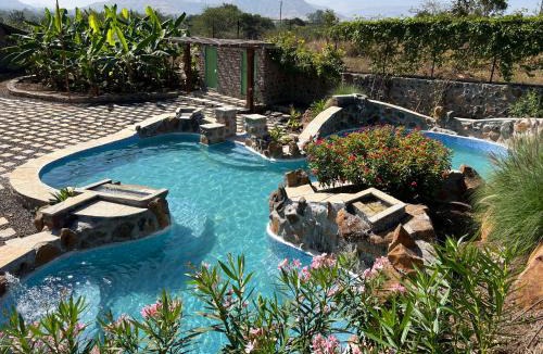 Mahiravani Villa | SaffronStays Lake House Bouganvillea, Nashik -villa with great lake views and patio dining