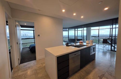 Sydney Olympic Park Apartment | Sky-High 3BR Oasis: City/Park View & Two Secure Parking Spots