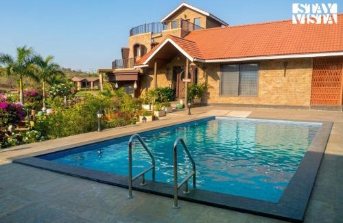 Anjaneri Villa | StayVista's Cerenity Castle - Lakeside Haven with Hill-View, Terrace & Indoor Entertainment