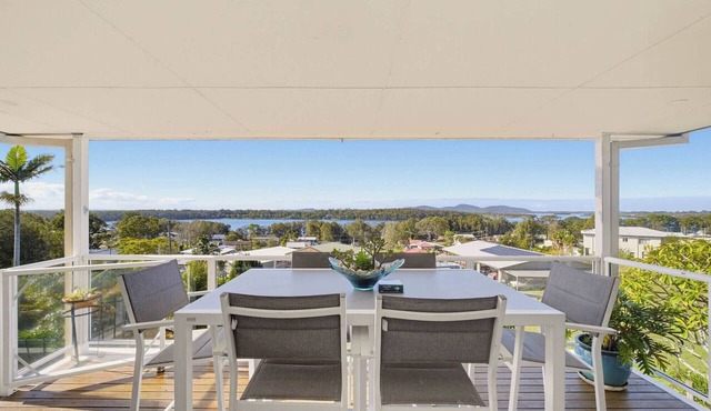 Large group retreat overlooking beautiful Wallis Lake with stunning views. in Coomba Park