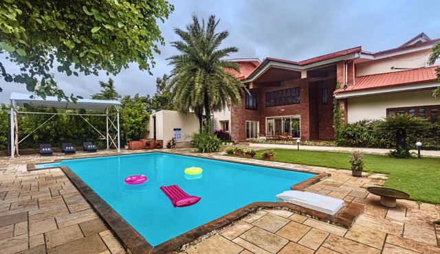SaffronStays Ananya - 4BR villa with pool, minibar & game room near river Ullas in Karjat