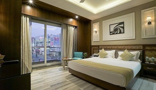 Suit Room With City & Balcony View