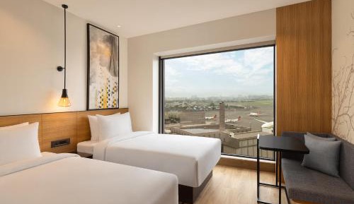 Deluxe Twin Room with Garden View with 50% discount on Buffet , 10% off on Airport Transfers , Laundry and Happy Hours on beverages enjoy 1+1 offer on select beverages