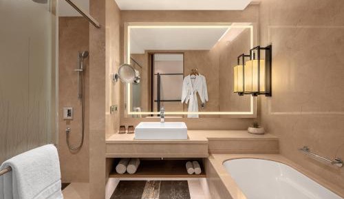 Deluxe Guest Room, 2 Queen Beds with Bathtub  - INR 1000 SPA Credit (Stay between Sunday to Thursday)  - Complimentary beer on arrival and free shuttle to the beach