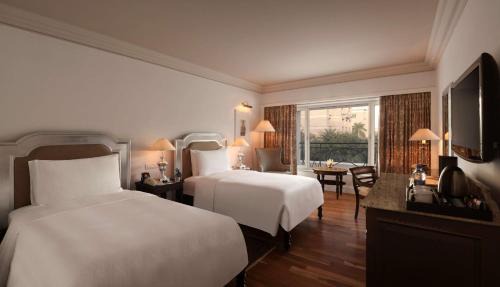 Twin Room with Happy Hours 1+1 offer at Lounge Bar , 30% off on Food & Beverages and 20% discount on Spa